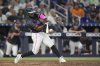 Miami Marlins' Otto Lopez hits a double to bring in two runs in the eighth inning of a baseball game against the Kansas City Royals, Saturday, July 19, 2025, in Miami. (AP Photo/Rebecca Blackwell)