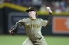 San Diego Padres starting pitcher JP Sears throws against the Arizona Diamondbacks during the first inning of a baseball game Monday, Aug. 4, 2025, in Phoenix. (AP Photo/Ross D. Franklin)