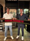 Canadian Steve Nijjar (left) and co-owner Morris Pagniello, hold up a Racing Madrid FC scarf in this undated handout photo. The team just won promotion to Spain's fifth tier. THE CANADIAN PRESS/Handout — Steve Nijjar (Mandatory Credit)