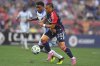 CF Montréal forward Dante Sealy, left, and New England Revolution defender Peyton Miller, right, vie for control of the ball during the first half of an MLS soccer match, Friday, July 25, 2025, in Foxborough, Mass. (AP Photo/Steven Senne)