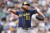 Milwaukee Brewers starting pitcher Brandon Woodruff throws against the Seattle Mariners during the fourth inning of a baseball game Monday, July 21, 2025, in Seattle. (AP Photo/Lindsey Wasson)