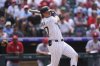 Colorado Rockies' Jordan Beck singles against St. Louis Cardinals relief pitcher Andre Granillo in the seventh inning of a baseball game Wednesday, July 23, 2025, in Denver. (AP Photo/David Zalubowski)