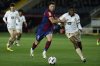 FILE - Barcelona's Robert Lewandowski fights for the ball with Valencia's Cristhian Mosquera, right, during a Spanish La Liga soccer match between Barcelona and Valencia at the Olimpic Lluis Companys stadium in Barcelona, Spain, on April 29, 2024. (AP Photo/Joan Monfort, File)