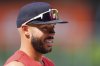 Minnesota Twins shortstop Carlos Correa warms up before a baseball game against the Colorado Rockies, Saturday, July 19, 2025, in Denver. (AP Photo/David Zalubowski)