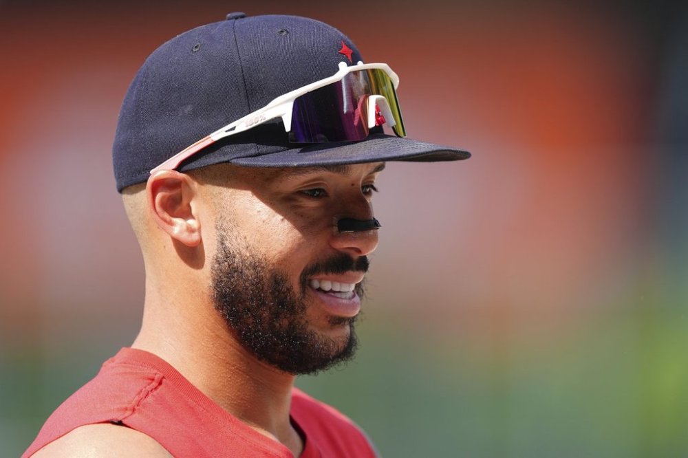 Minnesota Twins shortstop Carlos Correa warms up before a baseball game against the Colorado Rockies, Saturday, July 19, 2025, in Denver. (AP Photo/David Zalubowski)
