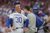 Los Angeles Dodgers' Shohei Ohtani is taken out of the game during the fourth inning of a baseball game against the Cincinnati Reds Wednesday, July 30, 2025, in Cincinnati. (AP Photo/Carolyn Kaster)