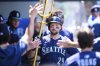 Seattle Mariners' Cal Raleigh is greeted by teammates after hitting a home run during the seventh inning of a baseball game against the Los Angeles Angels Sunday, July 27, 2025, in Anaheim, Calif. (AP Photo/William Liang)