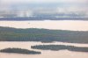 Smoke and trees burned by wildfires in northern Manitoba are shown during a helicopter tour in the surrounding area of Flin Flon, Man. on Thursday, June 12, 2025. THE CANADIAN PRESS/Mike Deal-Pool