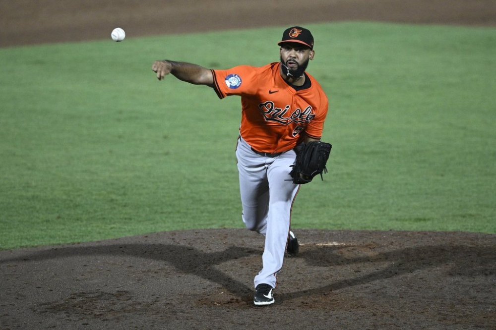 Baltimore Orioles pitcher Seranthony Domínguez throws to home plate during the eighth inning of a baseball game against the Tampa Bay Rays, Saturday, July 19, 2025, in Tampa, Fla. (AP Photo/Phelan M. Ebenhack)