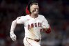 Los Angeles Angels' Zach Neto runs to first base during the eighth inning of a baseball game against the Seattle Mariners Friday, July 25, 2025, in Anaheim, Calif. (AP Photo/Eric Thayer)
