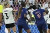 Germany's Kathrin Hendrich, left, pulls on hair of France's Griedge Mbock Bathy, right, during the Women's Euro 2025 quarterfinals soccer match between France and Germany at St. Jakob-Park in Basel, Switzerland, Saturday, July 19, 2025. (AP Photo/Martin Meissner)