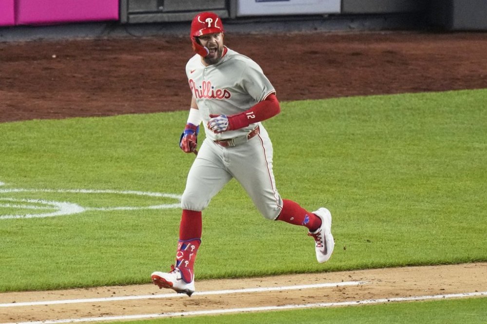 Philadelphia Phillies' Kyle Schwarber celebrates as he runs for a single during the seventh inning of a baseball game against the New York Yankees Friday, July 25, 2025, in New York. (AP Photo/Frank Franklin II)