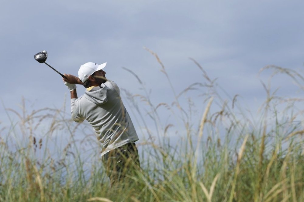 Scottie Scheffler of the United States hits his tee shot on the 8th hole during the second round of the British Open golf championship at the Royal Portrush Golf Club, Northern Ireland, Friday, July 18, 2025. (AP Photo/Jon Super)