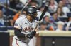 San Francisco Giants' Dominic Smith hits an RBI single during the 10th inning of a baseball game against the New York Mets Friday, Aug. 1, 2025, in New York. (AP Photo/Frank Franklin II)
