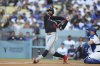 Minnesota Twins' Byron Buxton strikes out during the first inning of a baseball game against the Los Angeles Dodgers Tuesday, July 22, 2025, in Los Angeles. (AP Photo/Eric Thayer)