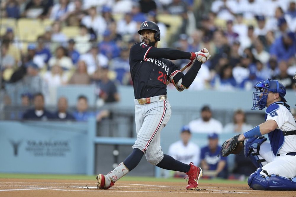 Minnesota Twins' Byron Buxton strikes out during the first inning of a baseball game against the Los Angeles Dodgers Tuesday, July 22, 2025, in Los Angeles. (AP Photo/Eric Thayer)