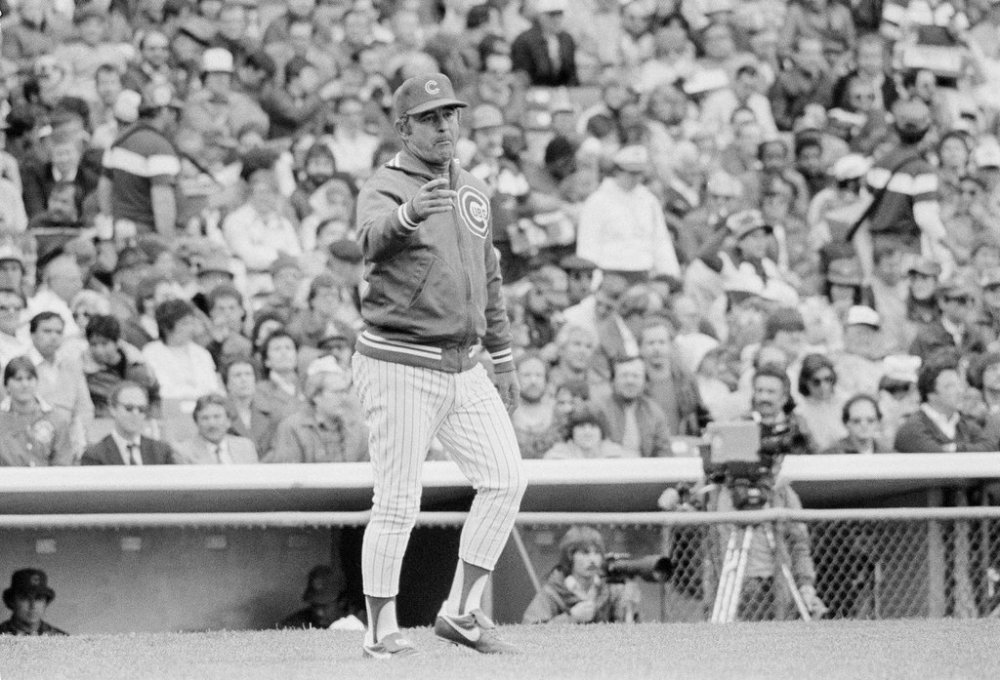 FILE - Chicago Cubs manager Lee Elia signals the bullpen to send in a right-hander during a game against the Atlanta Braves in Chicago, May 19, 1983. (AP Photo/Fred Jewel, File)