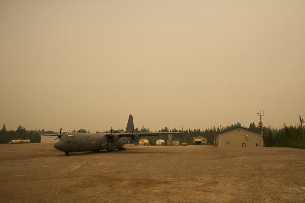 A C-130 Hercules aircraft is seen in Norway House, Man., Tuesday, June 3, 2025 as members of the Royal Canadian Air Force help evacuees. THE CANADIAN PRESS/David Lipnowski