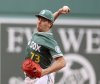 Boston Red Sox pitcher Hunter Dobbins throws during the first inning of a baseball game against the Tampa Bay Rays Friday, July 11, 2025, in Boston. (AP Photo/Mark Stockwell)