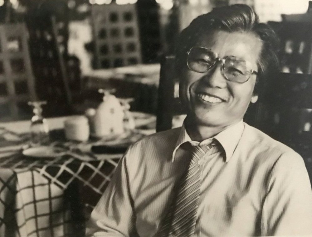 In this photo taken between 1985 and 1986 and provided by Paul Shin Family, Paul Shin, whose decadeslong career in journalism, including nearly 20 years with The Associated Press, smiles at Seoul Foreign Correspondents Club in Seoul, South Korea. (Courtesy of Paul Shin Family via AP)