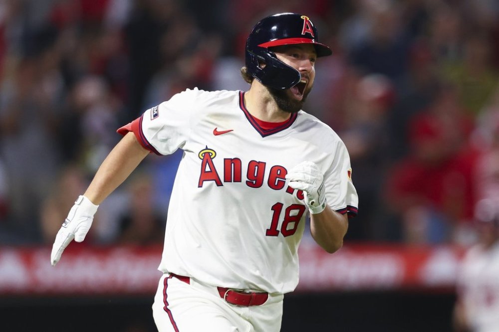 Los Angeles Angels Nolan Schanuel reacts while running towards first base after hitting an RBI single during the eighth inning of a baseball game against the Arizona Diamondbacks in Anaheim, Calif., Saturday, July 12, 2025. (AP Photo/Jessie Alcheh)