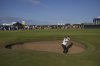 Miyu Yamashita of Japan chips out of a bunker on the 17th green during the third round of the Women's British Open golf championship, at Royal Porthcawl Golf Club in Porthcawl, Wales, Saturday, Aug. 2, 2025. (AP Photo/Kin Cheung)