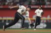 Texas Rangers shortstop Corey Seager (5) fields a ground ball hit by Detroit Tigers' Spencer Torkelson during the fourth inning of a baseball game on Friday, July 18, 2025, in Arlington, Texas. (AP Photo/Sam Hodde)