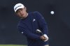 Collin Morikawa of the United States plays a shot on the 15th hole during a practice round for the 2025 British Open golf championship at the Royal Portrush Golf Club, Northern Ireland, Monday, July 14, 2025. (AP Photo/Peter Morrison)