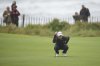 Mimi Rhodes of England lines up a putt on the 1st green during the final round of the Women's British Open golf championship, at Royal Porthcawl Golf Club in Porthcawl, Wales, Sunday, Aug. 3, 2025. (AP Photo/Kin Cheung)