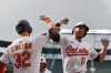 Baltimore Orioles' Jordan Westburg (11) celebrates with Ryan O'Hearn (32) after hitting a two-run home run during the second inning in the second baseball game of a doubleheader against the New York Mets, Thursday, July 10, 2025, in Baltimore. (AP Photo/Stephanie Scarbrough)