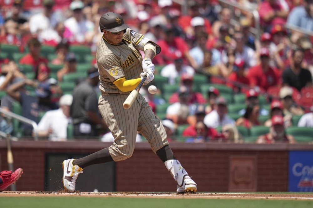 San Diego Padres' Manny Machado doubles during the first inning of a baseball game against the St. Louis Cardinals Sunday, July 27, 2025, in St. Louis. (AP Photo/Jeff Roberson)
