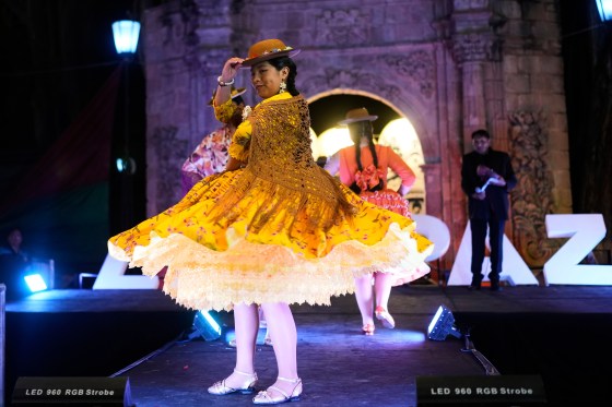 A woman competes in the Miss Cholita Pacena beauty pageant, an annual contest aiming to recognize Aymara Indigenous women's fashion and beauty, as well as their command of the Indigenous lifestyle and language, in La Paz, Bolivia on June 27. (Juan Karita / The Associated Press)
