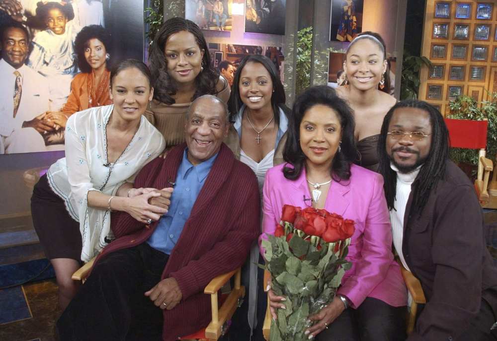 Members of Bill Cosby's television family, the Huxtables, gather in NBC's Today show studio for an interview in May 2002. From left are Sabrina Le Beauf, Tempest Bledsoe, Cosby, Keshia Knight Pulliam, Phylicia Rashad, Raven Symone and Malcolm-Jamal Warner. (AP Photo/Richard Drew)