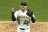 Pittsburgh Pirates pitcher David Bednar celebrates getting the final out of a baseball game against the Detroit Tigers in Pittsburgh, Tuesday, July 22, 2025. (AP Photo/Gene J. Puskar)