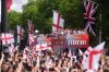 Buses carrying England players and staff make their way down the Mall during a Homecoming Victory Parade in London, Tuesday July 29, 2025, two days after England defended their European Championship crown as they beat Spain on penalties in the final of Euro 2025. (Adam Davy/PA via AP, Pool)