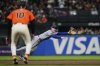 San Francisco Giants' Casey Schmitt, foreground, watches as New York Mets second baseman Brett Baty is unable to catch a single hit by Patrick Bailey during the fifth inning of a baseball game Friday, July 25, 2025, in San Francisco. (AP Photo/Godofredo A. Vásquez)