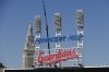 FILE - Workers finish installing the Cleveland Guardians sign above the scoreboard at Progressive Field, March 17, 2022, in Cleveland. (AP Photo/Ron Schwane, file)