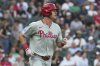 Philadelphia Phillies' Max Kepler watches after hitting sacrifice fly during the second inning of a baseball game against the Chicago White Sox in Chicago, Tuesday, July 29, 2025. (AP Photo/Nam Y. Huh)