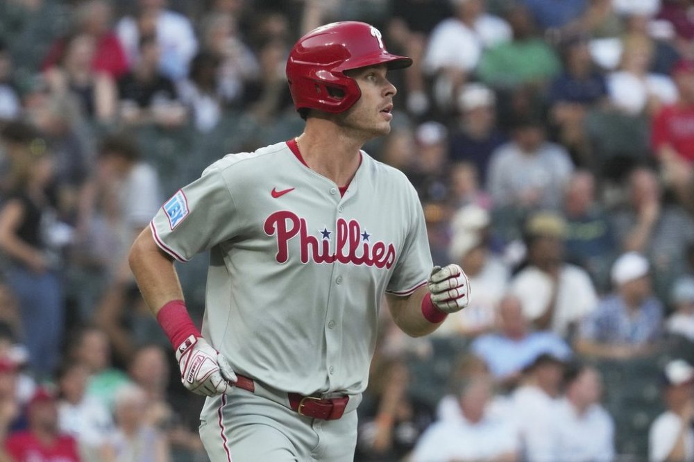 Philadelphia Phillies' Max Kepler watches after hitting sacrifice fly during the second inning of a baseball game against the Chicago White Sox in Chicago, Tuesday, July 29, 2025. (AP Photo/Nam Y. Huh)