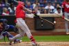 Cincinnati Reds outfielder Jake Fraley (27) hits a double during the sixth inning of a baseball game against the New York Mets, Saturday, July 19, 2025, in New York. (AP Photo/Yuki Iwamura)