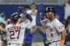 Houston Astros' Jose Altuve celebrates after hitting a two-run homer that brought home Jesus Sanchez (4), in the first inning of a baseball game against the Miami Marlins, Tuesday, Aug. 5, 2025, in Miami. (AP Photo/Rebecca Blackwell)