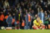 Watford's Ryan Porteous sits dejected after the English League Cup soccer match between Manchester City and Watford in Manchester, England, Tuesday, Sept. 24, 2024. (AP Photo/Dave Thompson)