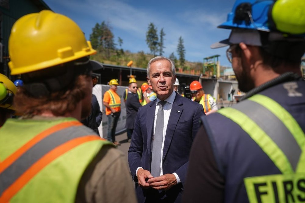 Prime Minister Mark Carney greets employees after touring the Gorman Brothers Lumber sawmill and making an announcement, in West Kelowna, B.C., on Tuesday, Aug. 5, 2025. THE CANADIAN PRESS/Darryl Dyck