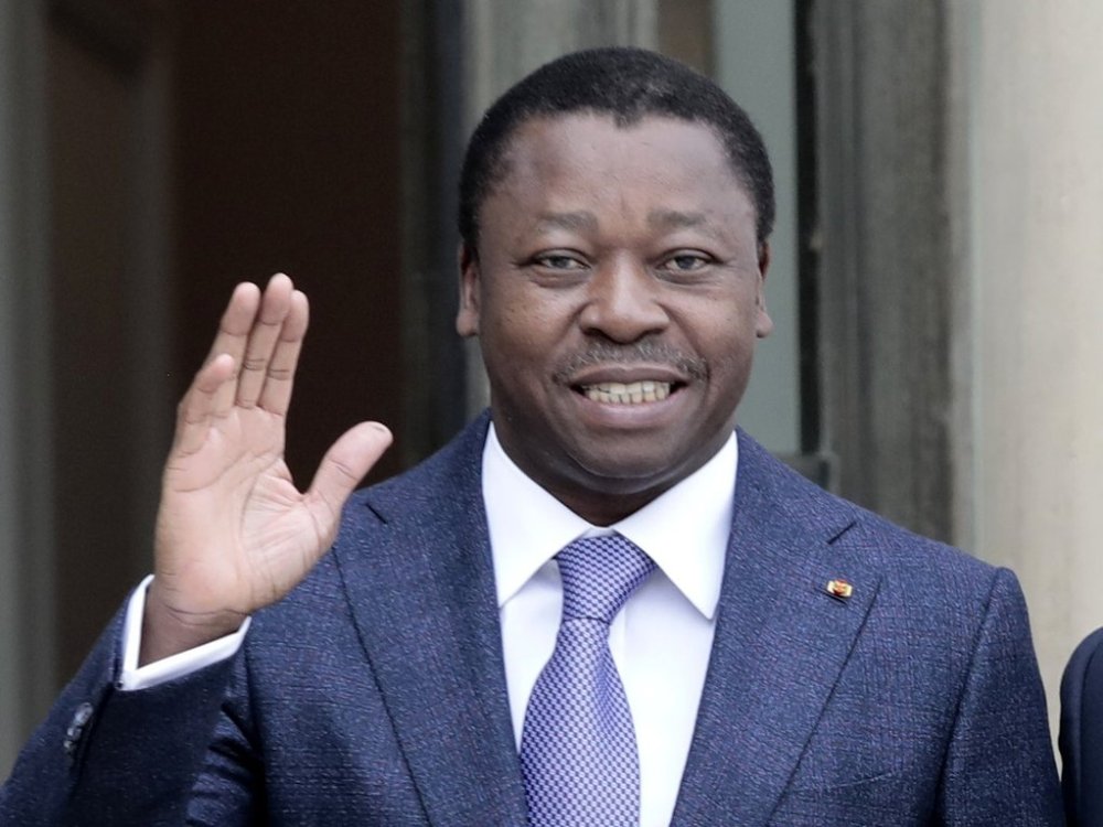 FILE - Togo's President Faure Gnassingbe waves before a working lunch at the Elysee Palace in Paris on April 9, 2021. (AP Photo/Lewis Joly, File)