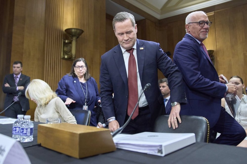 Christine Toretti, left, nominee for U.S. Ambassador to Sweden, former White House National Security Adviser Michael Waltz, nominee for U.S. Representative to the United Nations, and John Arrigo, right, nominee for U.S. Ambassador to Portugal, arrive to a Senate Foreign Relations Committee nomination hearing, Tuesday, July 15, 2025, on Capitol Hill in Washington. (AP Photo/Jacquelyn Martin)