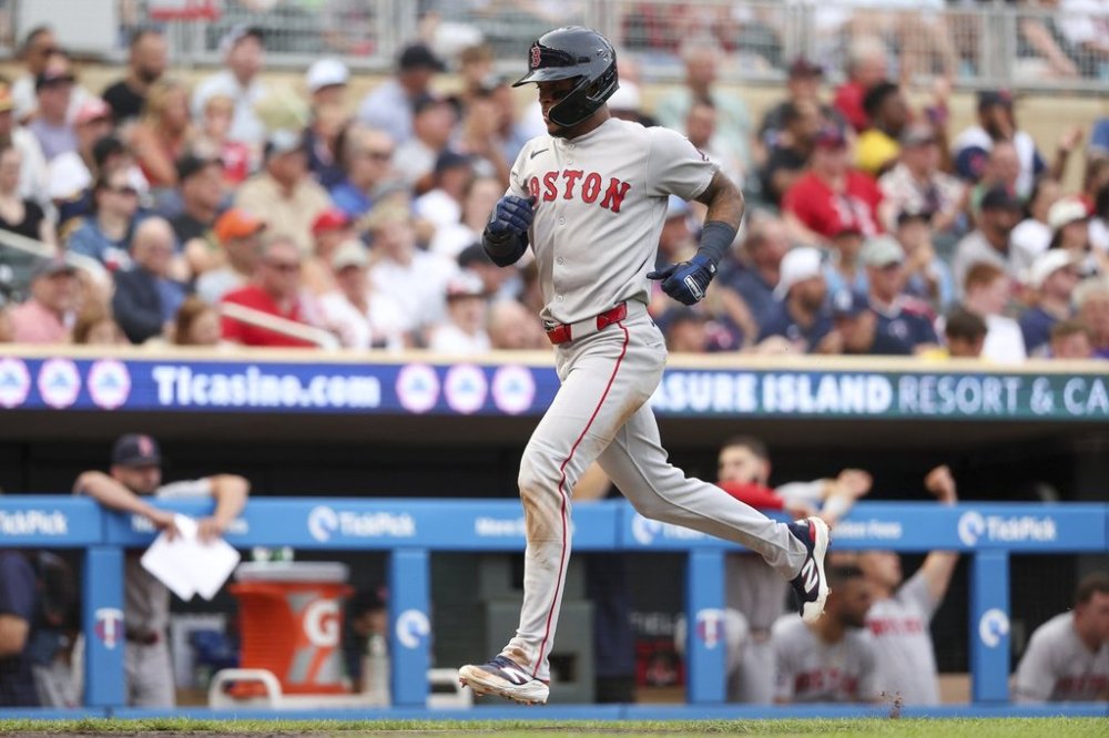 Boston Red Sox Ceddanne Rafaela scores on a single hit by Roman Anthony during the third inning of baseball game against the Minnesota Twins Tuesday, July 29, 2025, in Minneapolis. (AP Photo/Matt Krohn)