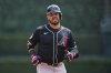 Arizona Diamondbacks designated hitter Eugenio Suarez runs back to the dugout after flying out to Detroit Tigers right fielder Kerry Carpenter during the second inning of a baseball game, Wednesday, July 30, 2025, in Detroit. (AP Photo/Ryan Sun)