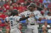 Miami Marlins' Jesus Sanchez, right, is congratulated by teammate Xavier Edwards (9) after hitting a two-run home run during the third inning of a baseball game against the St. Louis Cardinals Wednesday, July 30, 2025, in St. Louis. (AP Photo/Jeff Roberson)