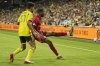 Toronto FC forward Tyrese Spicer, right, kicks the ball over Nashville SC midfielder Ahmed Qasem (37) during the first half of an MLS soccer match Saturday, July 19, 2025, in Nashville, Tenn. (AP Photo/George Walker IV)