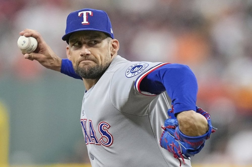 Texas Rangers starting pitcher Nathan Eovaldi throws against the Houston Astros during the first inning of a baseball game Sunday, July 13, 2025, in Houston. (AP Photo/David J. Phillip)